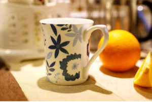front view of flower decoration mugs