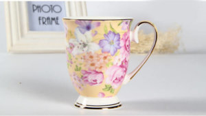 yellow back fine bone china mug with flower decoration