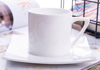 white bone china cup with square saucer