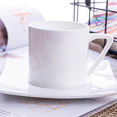 white bone china cup with square saucer