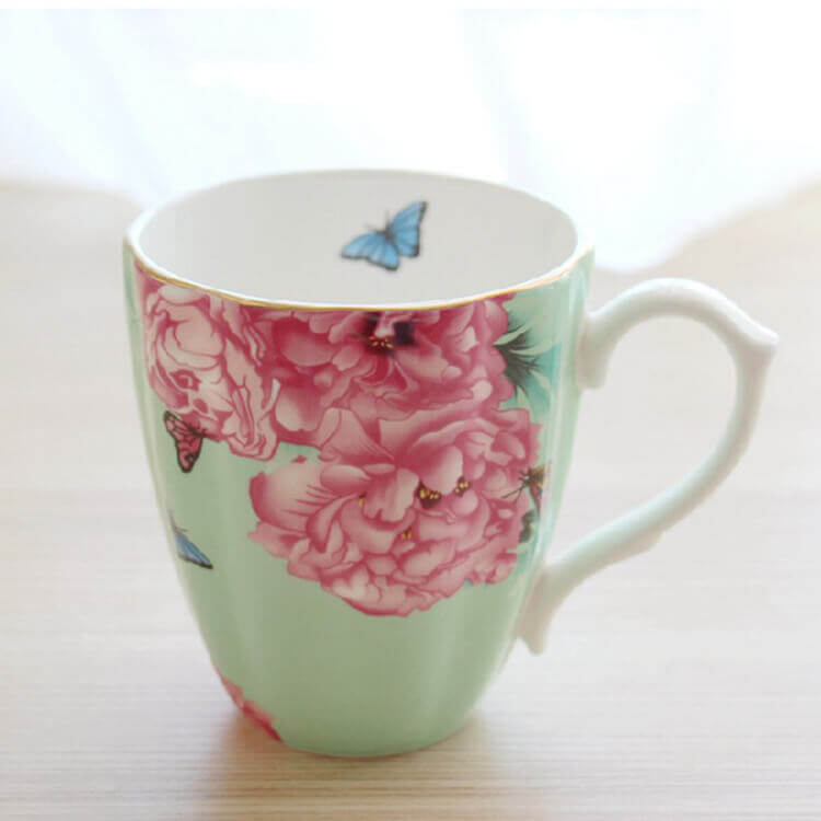 green base flowers and butterfly mug